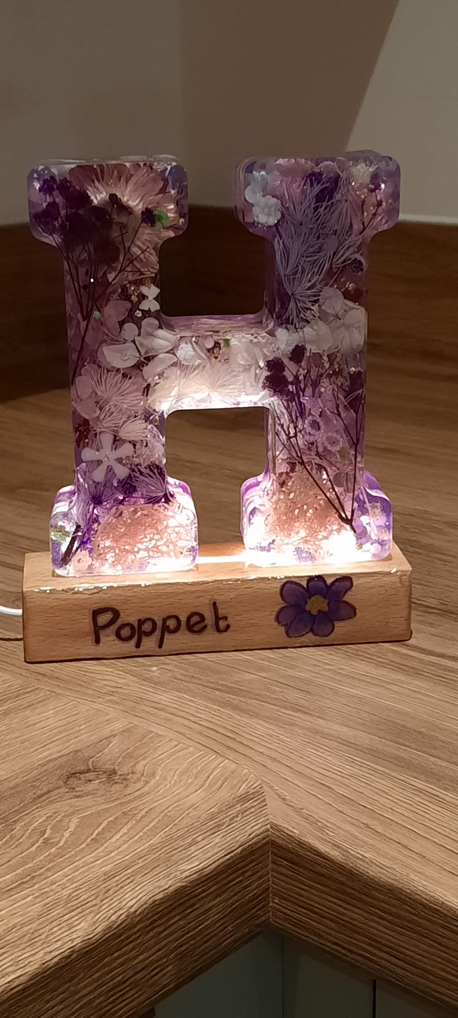 Handmade light-up resin letter H with pressed flowers